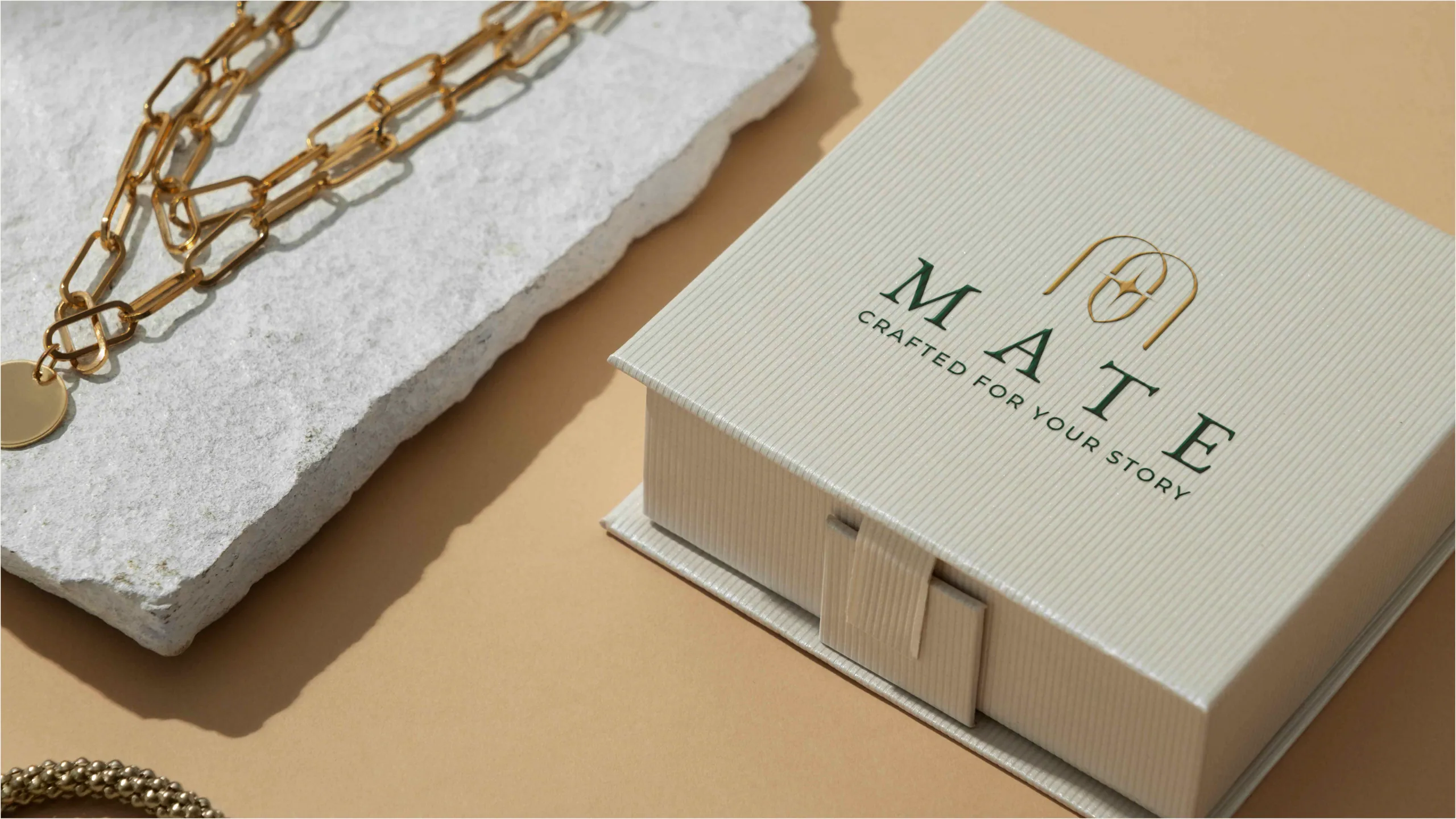 MATE Jewelry brand guideline page showing monogram mark and forest-green palette